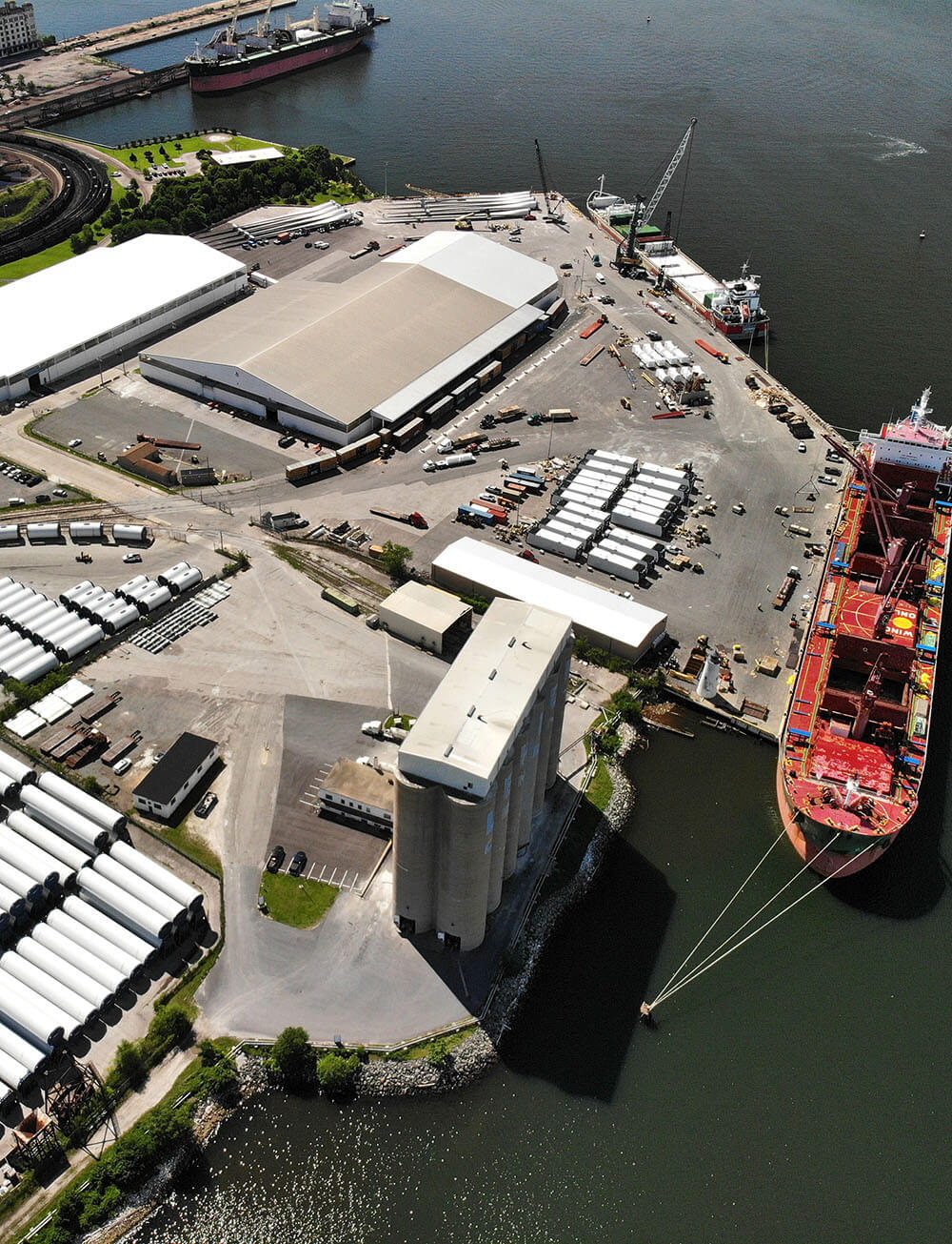 view from a drone of a pier at rukert terminals loaded with wind turbine components